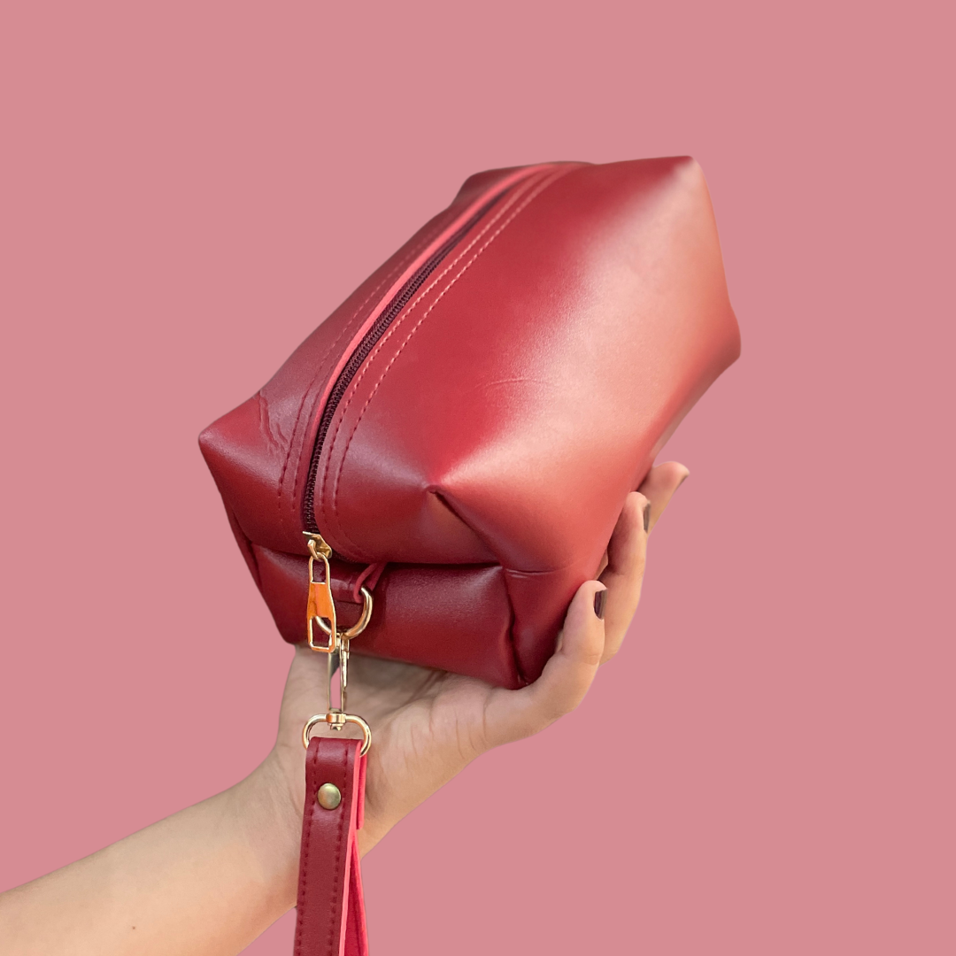 Adorned Makeup Pouch Maroon Travel Cosmetic Bag in hand